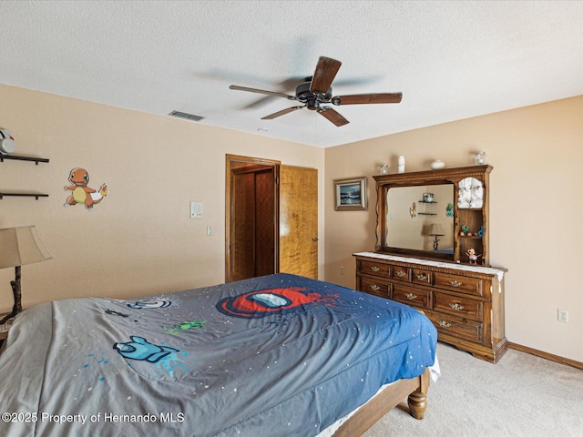 8393 Delaware Dr, Weeki Wachee, FL 34607 - bedroom featuring light colored carpet, ceiling fan, baseboards, and a textured ceiling