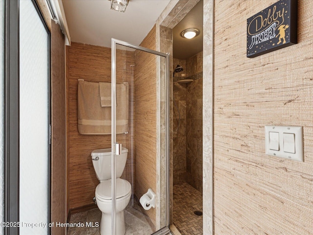 8393 Delaware Dr, Weeki Wachee, FL 34607 - bathroom with a stall shower and toilet