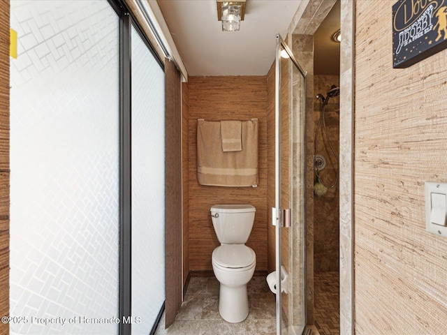 8393 Delaware Dr, Weeki Wachee, FL 34607 - full bathroom featuring a stall shower, toilet, and tile patterned flooring