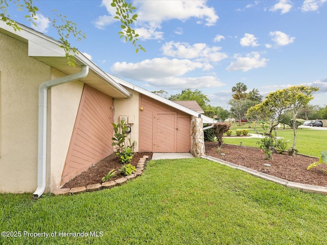 8393 Delaware Dr, Weeki Wachee, FL 34607 - view of grassy yard featuring a storage shed and an outbuilding