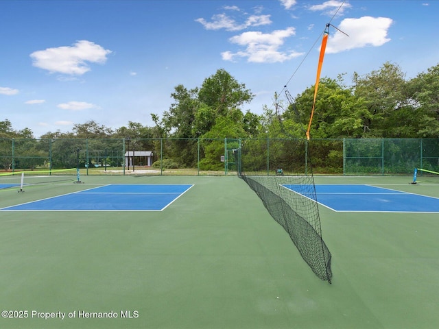 8393 Delaware Dr, Weeki Wachee, FL 34607 - view of tennis court featuring fence
