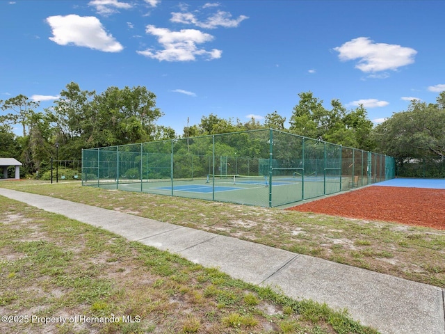 8393 Delaware Dr, Weeki Wachee, FL 34607 - view of tennis court featuring fence
