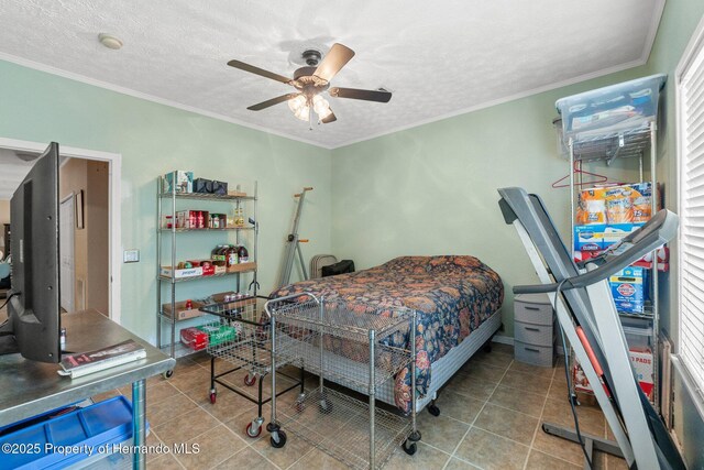 12253 Eskimo Curlew Rd, Brooksville, FL 34614 - bedroom with tile patterned floors, a ceiling fan, crown molding, and a textured ceiling
