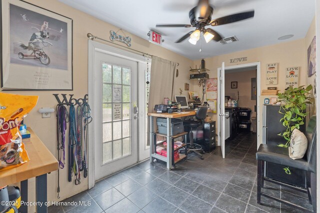 12253 Eskimo Curlew Rd, Brooksville, FL 34614 - office with ceiling fan and dark tile patterned flooring