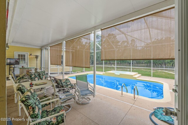 12253 Eskimo Curlew Rd, Brooksville, FL 34614 - outdoor pool with a patio, a lanai, and fence
