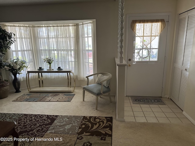 2351 Palm Springs Ct, Spring Hill, FL 34606 - foyer entrance featuring carpet and baseboards