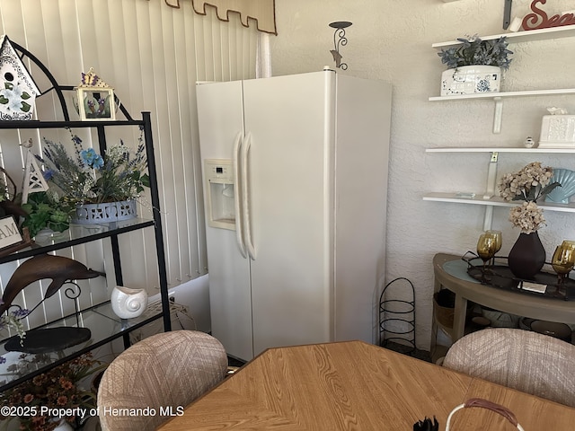 2351 Palm Springs Ct, Spring Hill, FL 34606 - kitchen with white fridge with ice dispenser