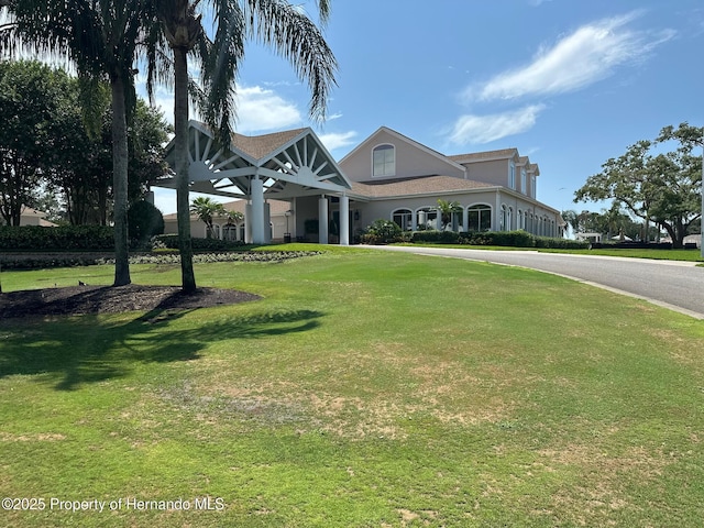 2351 Palm Springs Ct, Spring Hill, FL 34606 - view of front of home with a front yard and stucco siding
