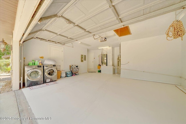 21000 Exeter Ct, Brooksville, FL 34601 - garage with washing machine and clothes dryer and a garage door opener
