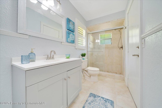 21000 Exeter Ct, Brooksville, FL 34601 - bathroom with vanity, a shower stall, toilet, a textured wall, and tile patterned floors