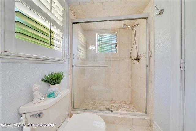 21000 Exeter Ct, Brooksville, FL 34601 - bathroom with toilet, a stall shower, and a textured wall
