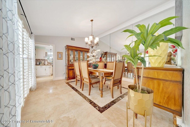 21000 Exeter Ct, Brooksville, FL 34601 - dining area with a chandelier, lofted ceiling, and baseboards