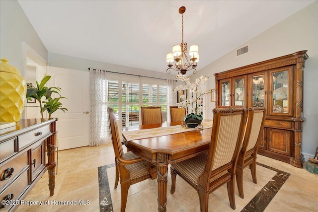 21000 Exeter Ct, Brooksville, FL 34601 - dining area with inlaid floor details, a chandelier, and vaulted ceiling