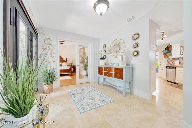 21000 Exeter Ct, Brooksville, FL 34601 - entrance foyer with light tile patterned floors and baseboards
