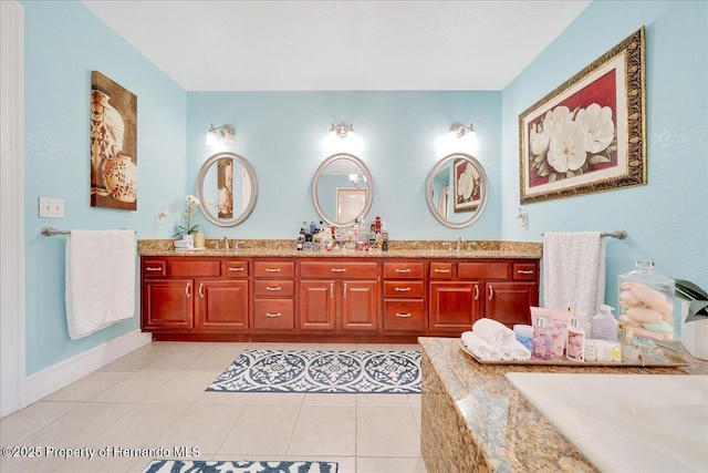 21000 Exeter Ct, Brooksville, FL 34601 - bathroom featuring double vanity, tile patterned flooring, a tub, and baseboards