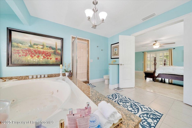 21000 Exeter Ct, Brooksville, FL 34601 - ensuite bathroom featuring a jetted tub, toilet, tile patterned flooring, a shower stall, and a chandelier