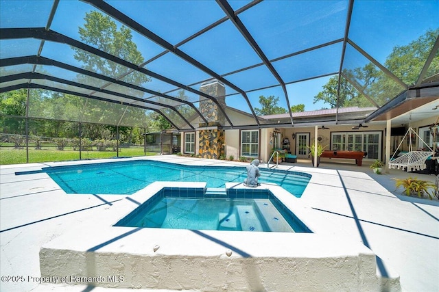 21000 Exeter Ct, Brooksville, FL 34601 - view of pool with ceiling fan, a patio, a pool with connected hot tub, outdoor lounge area, and glass enclosure