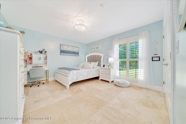 21000 Exeter Ct, Brooksville, FL 34601 - bedroom featuring an office area, baseboards, and light tile patterned floors