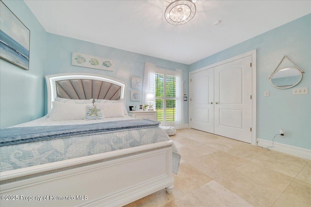 21000 Exeter Ct, Brooksville, FL 34601 - tiled bedroom featuring baseboards and a closet