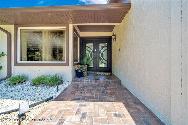 21000 Exeter Ct, Brooksville, FL 34601 - property entrance featuring french doors and stucco siding