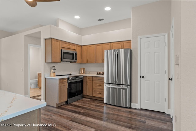 kitchen featuring appliances with stainless steel finishes, dark wood-type flooring, light countertops, recessed lighting, and ceiling fan