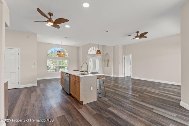 kitchen with a sink, ceiling fan, stainless steel dishwasher, dark wood-type flooring, and recessed lighting