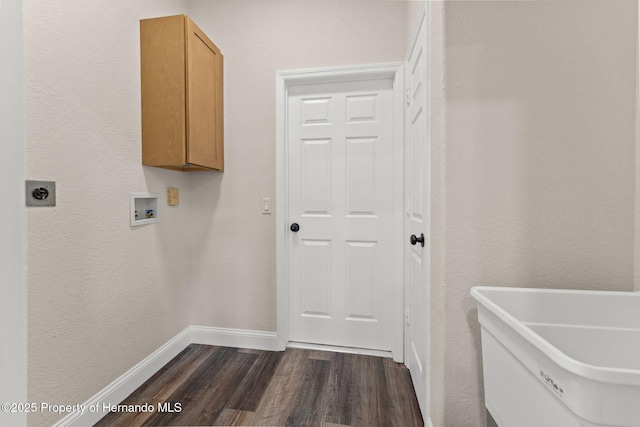 clothes washing area featuring cabinet space, electric dryer hookup, dark wood-style floors, washer hookup, and baseboards