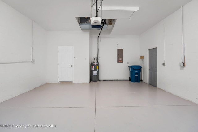 garage featuring water heater and electric panel