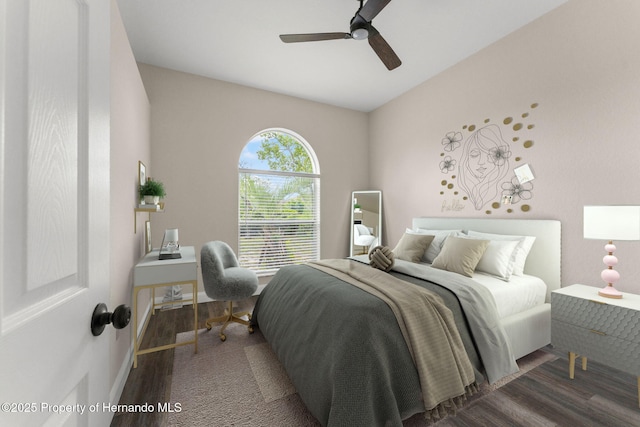 bedroom featuring wood finished floors, baseboards, and ceiling fan