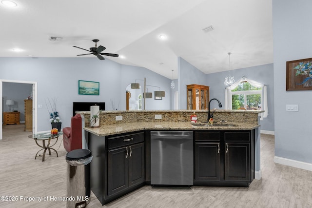 4960 Hidden Knob Trl, Spring Hill, FL 34609 - kitchen with stainless steel dishwasher, a sink, light wood finished floors, vaulted ceiling, and ceiling fan