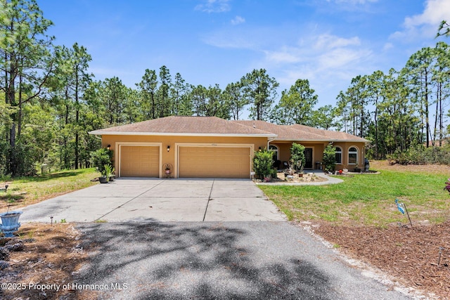 4960 Hidden Knob Trl, Spring Hill, FL 34609 - ranch-style home featuring stucco siding, an attached garage, a front lawn, and driveway