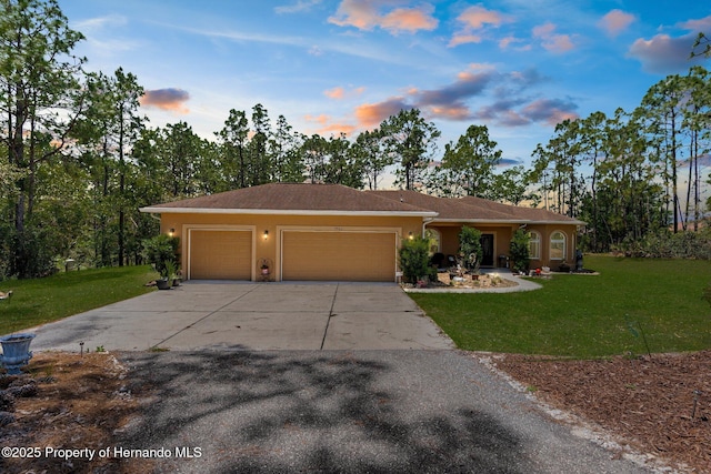 4960 Hidden Knob Trl, Spring Hill, FL 34609 - ranch-style house featuring a garage, concrete driveway, stucco siding, and a front lawn
