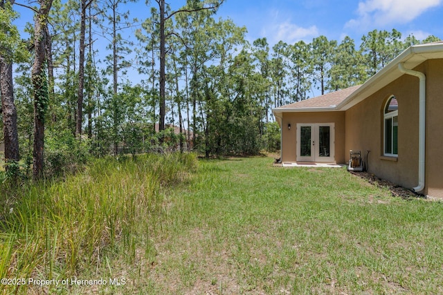 4960 Hidden Knob Trl, Spring Hill, FL 34609 - view of grassy yard with french doors