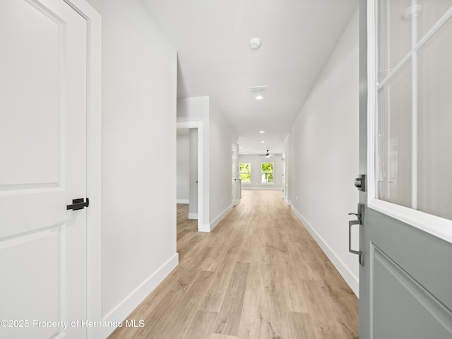 14353 Chimney Swift Rd, Weeki Wachee, FL 34614 - corridor with light wood-type flooring, baseboards, and recessed lighting