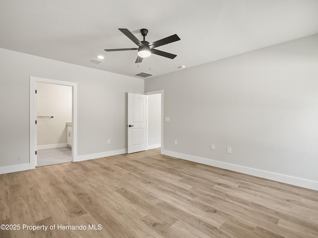 14353 Chimney Swift Rd, Weeki Wachee, FL 34614 - unfurnished bedroom featuring light wood-style floors, baseboards, ensuite bath, recessed lighting, and a ceiling fan
