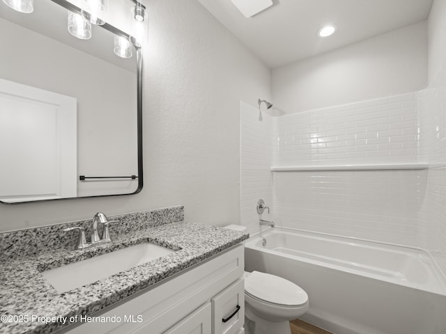 14353 Chimney Swift Rd, Weeki Wachee, FL 34614 - bathroom with toilet, bathing tub / shower combination, vanity, recessed lighting, and wood finished floors