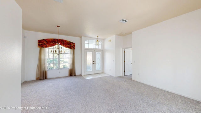 4048 St Ives Blvd, Spring Hill, FL 34609 - spare room featuring french doors, light colored carpet, and baseboards