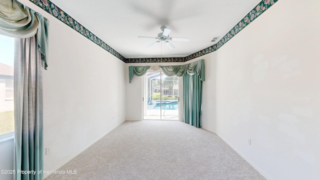 4048 St Ives Blvd, Spring Hill, FL 34609 - carpeted empty room featuring a ceiling fan and baseboards