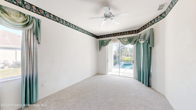 4048 St Ives Blvd, Spring Hill, FL 34609 - empty room featuring carpet, a ceiling fan, and baseboards
