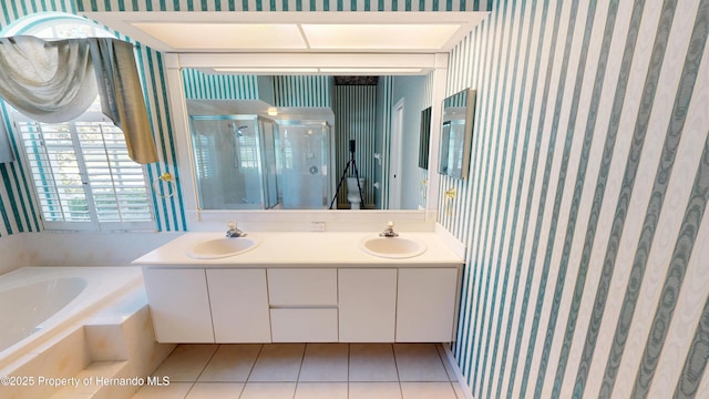 4048 St Ives Blvd, Spring Hill, FL 34609 - bathroom with a shower stall, wallpapered walls, a bath, tile patterned flooring, and double vanity