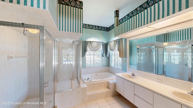 4048 St Ives Blvd, Spring Hill, FL 34609 - bathroom with wallpapered walls, a garden tub, a shower stall, tile patterned floors, and double vanity