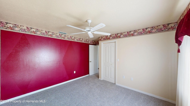 4048 St Ives Blvd, Spring Hill, FL 34609 - carpeted empty room featuring a ceiling fan and baseboards