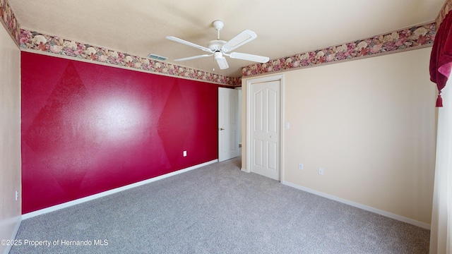 4048 St Ives Blvd, Spring Hill, FL 34609 - carpeted empty room featuring a ceiling fan and baseboards