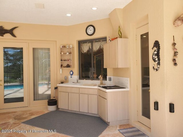 10430 Ramble Ridge Ct, Weeki Wachee, FL 34613 - kitchen featuring light brown cabinetry, light countertops, recessed lighting, and a sink
