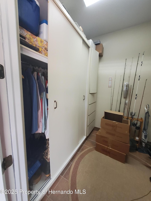 10430 Ramble Ridge Ct, Weeki Wachee, FL 34613 - walk in closet with tile patterned flooring