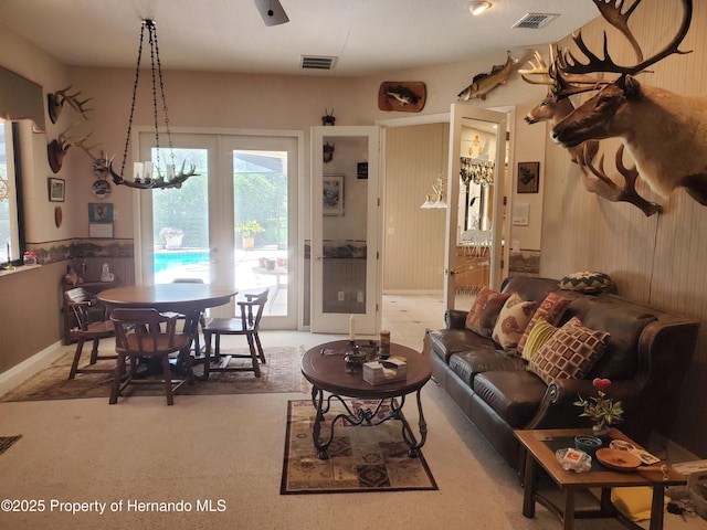 10430 Ramble Ridge Ct, Weeki Wachee, FL 34613 - living area with a chandelier and wood walls