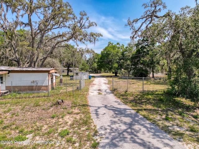 16173 Wiscon Rd, Brooksville, FL 34601 - view of asphalt driveway with a gated entry