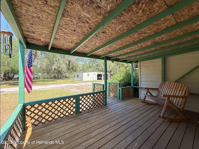 16173 Wiscon Rd, Brooksville, FL 34601 - wooden deck featuring an outdoor structure
