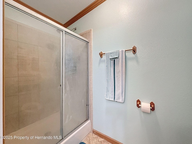 16173 Wiscon Rd, Brooksville, FL 34601 - bathroom with an enclosed shower, ornamental molding, and baseboards