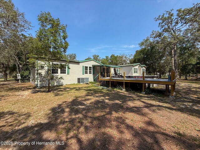 16173 Wiscon Rd, Brooksville, FL 34601 - back of property featuring a deck and central air condition unit